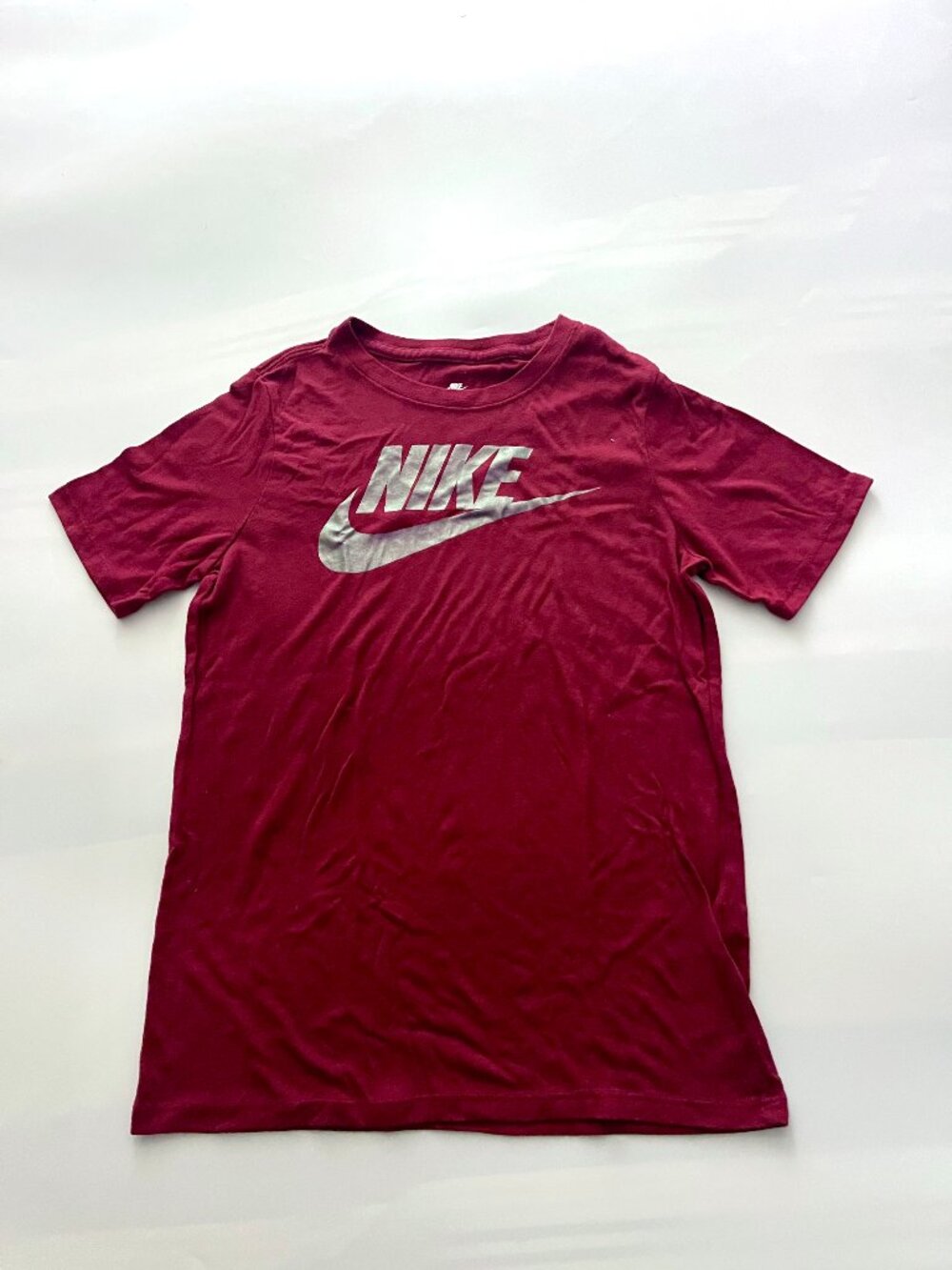 Women's Nike Shirt with swoosh logo, maroon color, silver logo size m